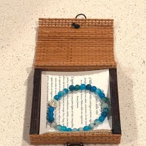 Blue Beaded Bracelet with Silver Charm